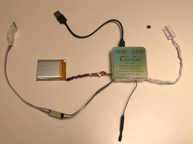 All the parts: Heltec CubeCell, battery, magnetic reed switch, and antenna