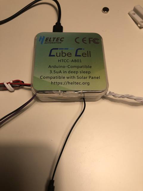 The CubeCell module wired up, with the magnetic reed switch and battery leads
