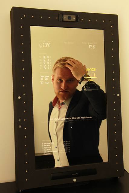 The smart mirror in action: Weather, birthdays, calendar, and Spotify all at once